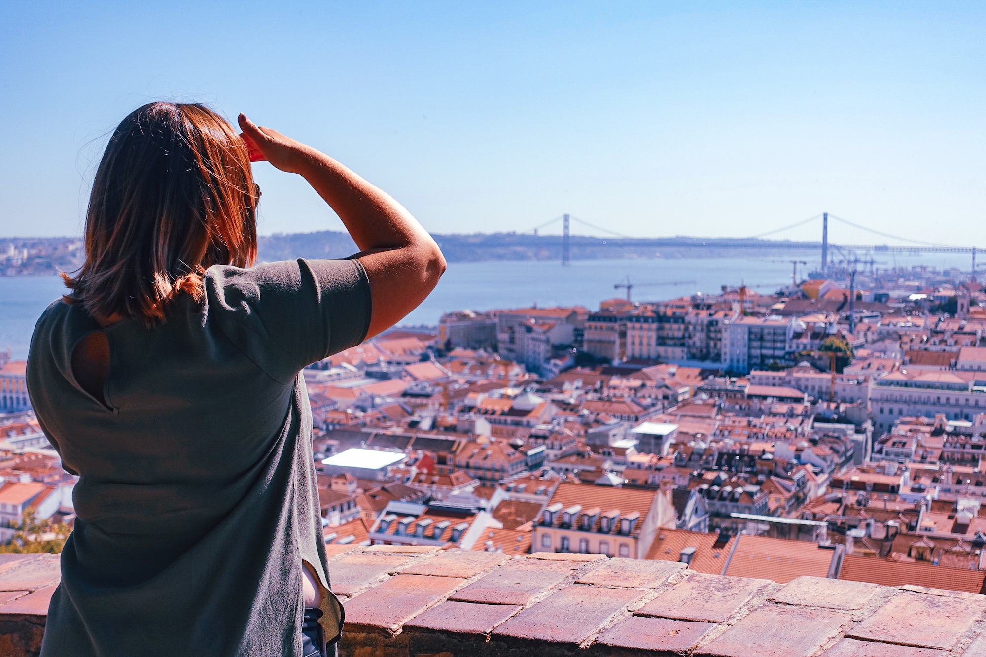 A girl looking out over the views of Lisbon, Portugal