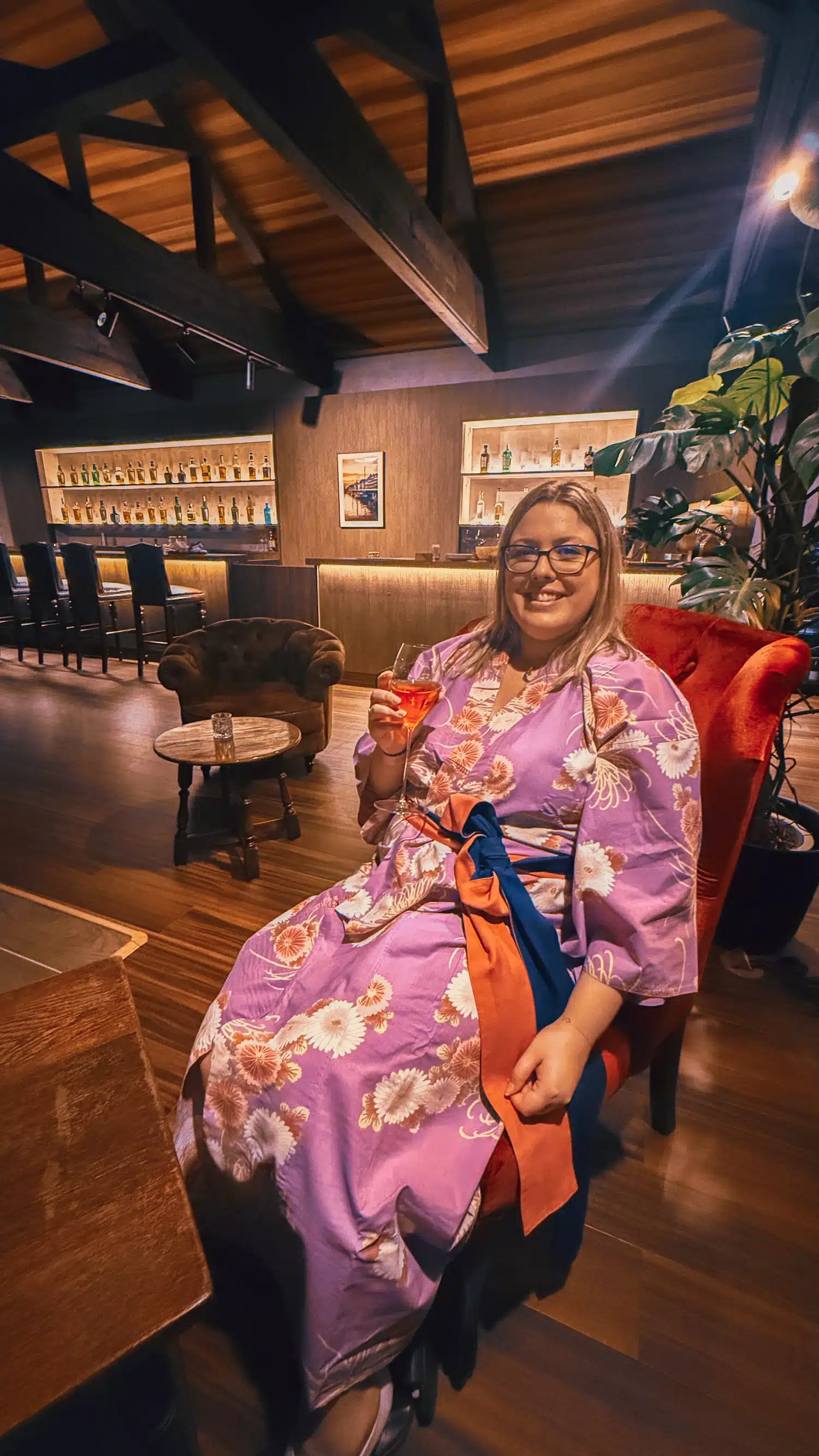 A girl sitting at a bar in a traditional Ryokan in Japan