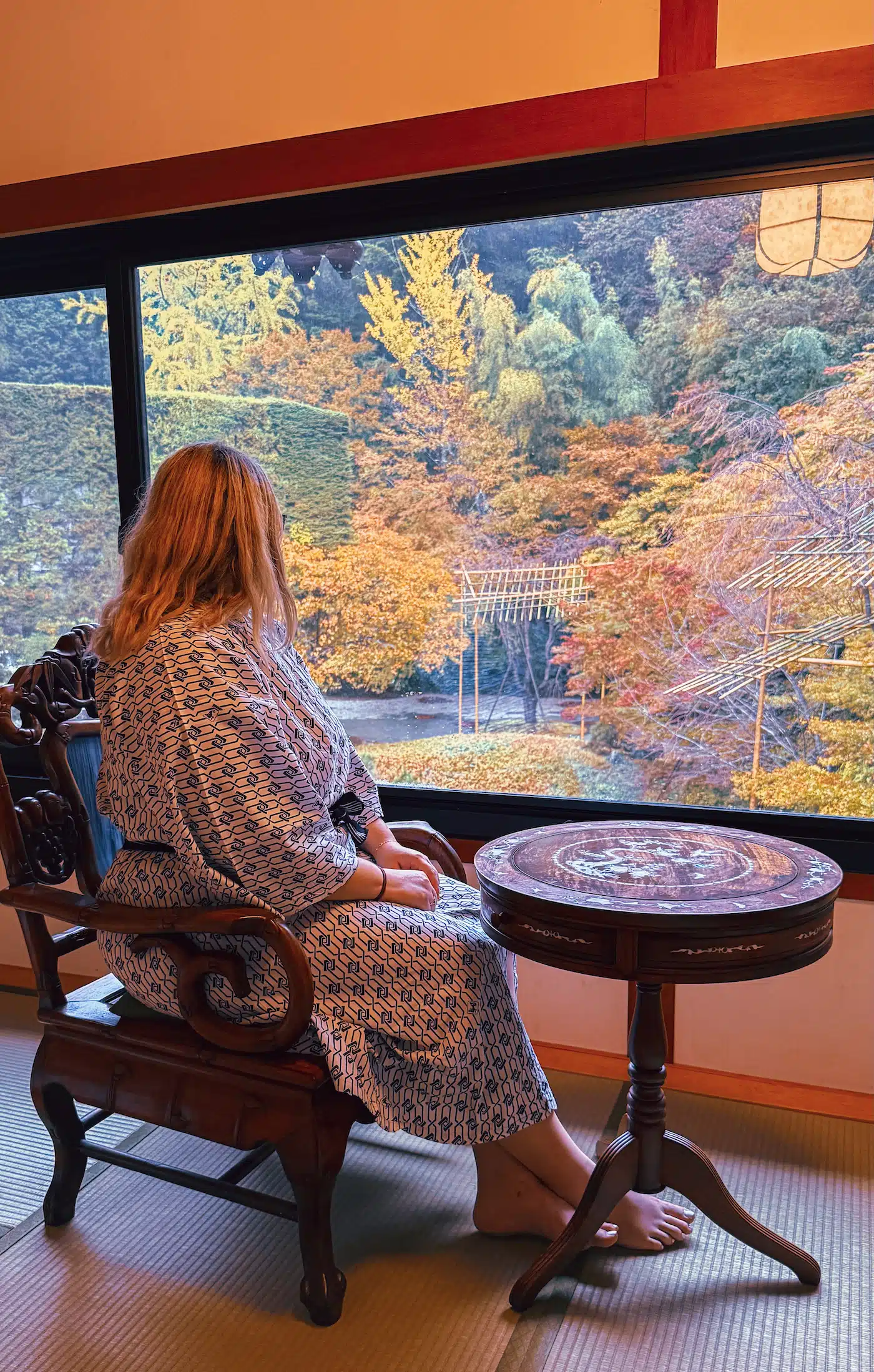 A girl looking out in the garden at a Temple stay in Koyasan
